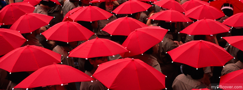 Short-haired girls wearing khaki blouses and red head umbrellas